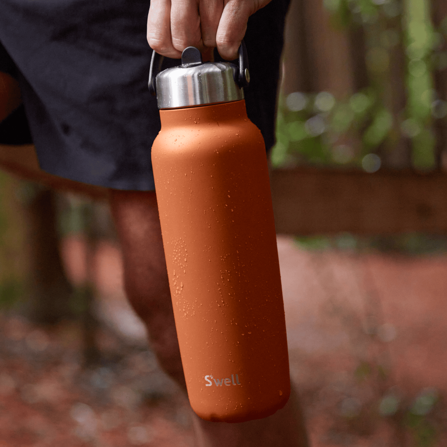 explorer-with-flip-straw-lid-40oz-f3 Swell-Explorer-Water-Bottle-40oz-Orange-Carnelian-LifeStyle.png